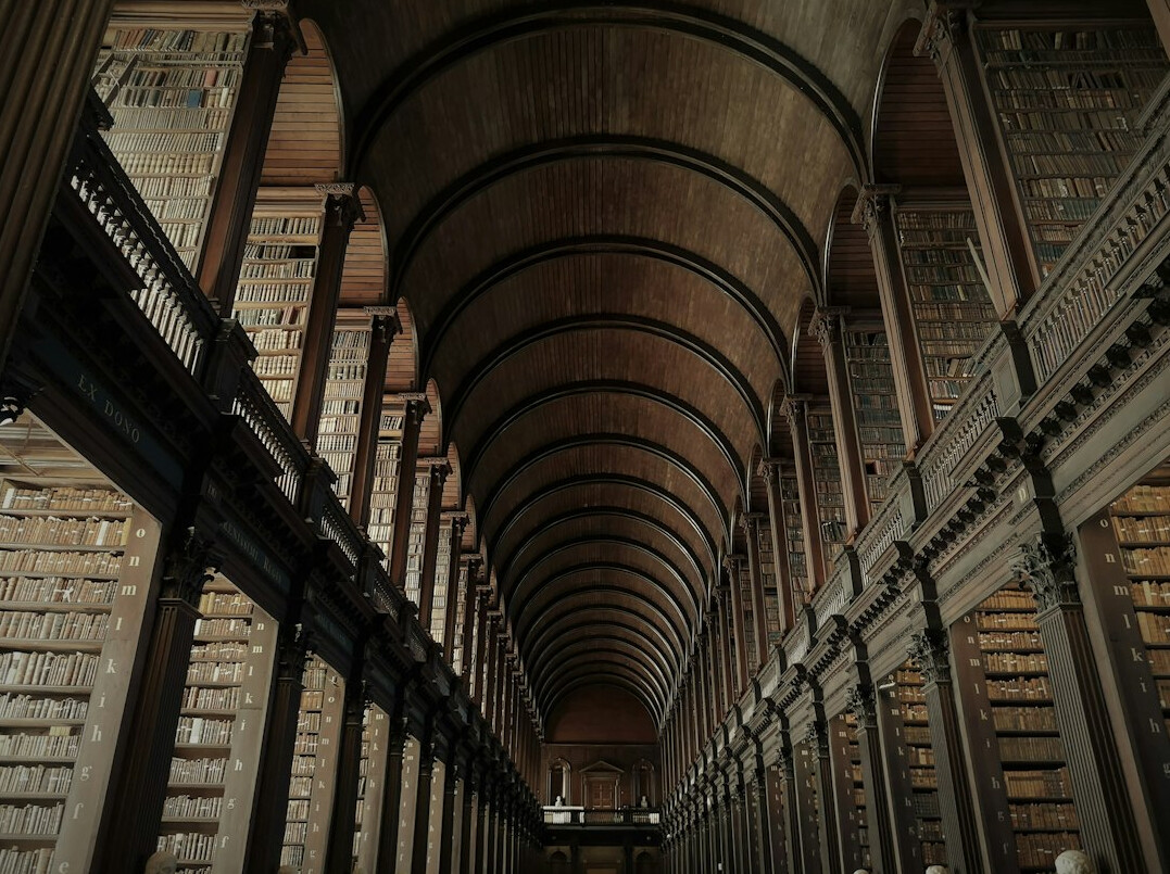 Rows of old books in a library
